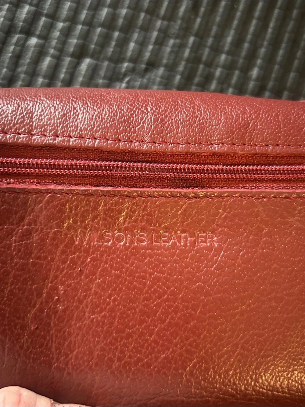 Wilson’s leather, maroon Leather trifold, wallet with Gold Accent